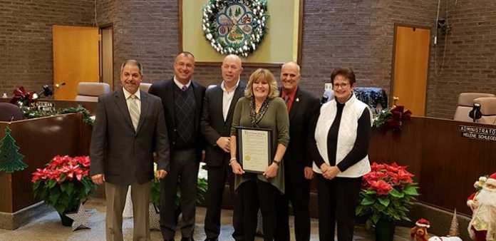 Retiring clerk Ann Marie Eden, center, and outgoing Councilwoman Ann Updegrave, right, were honored by the governing body at a recent meeting. (Photo by Bob Vosseller)