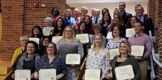 The 2019 Teachers of the Year and Educational Services Professional of the Year gather at the Jackson Memorial High School Fine Arts Auditorium during a Jan. 15 School Board meeting where they received their awards. (Photo by Bob Vosseller)