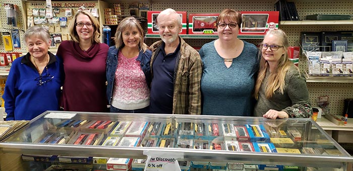 The matriarch of the Jackson Hobby Shop, Sylvia Gustafson, left, joins family members Ann-Marie Porrino, Jeanette Tepel, Frank and Debbie Gustafson and Doreen Burkhart during the shop’s closing day on Jan. 19 after 50 years in business. (Photo by Bob Vosseller)