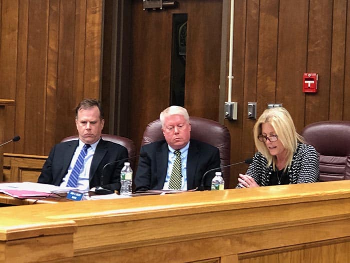 Business administrator Joanne Bergin reads comments to the public alongside Mayor John G. Ducey (right) and attorney Scott W. Kenneally. (Photo by Judy Smestad-Nunn)