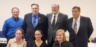Jackson School Board members assemble during a recent Board of Education meeting. Board member Thomas Colucci, left, standing, Board President John Burnetsky, Michael Walsh, Gus Acevedo, sitting from left are Vicki Grasso, Vice Board President Sharon Dey, and Tara Rivera.