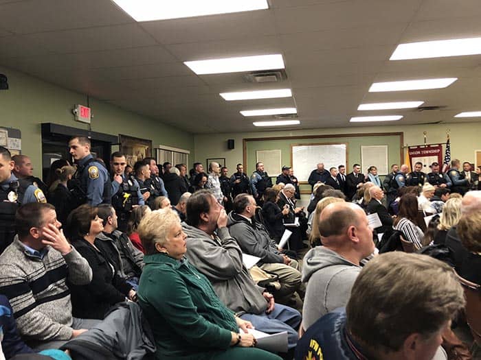 The meeting was packed with the families and friends of the five officers being honored by the council at the March 5 meeting. (Photo by Kimberly Bosco)