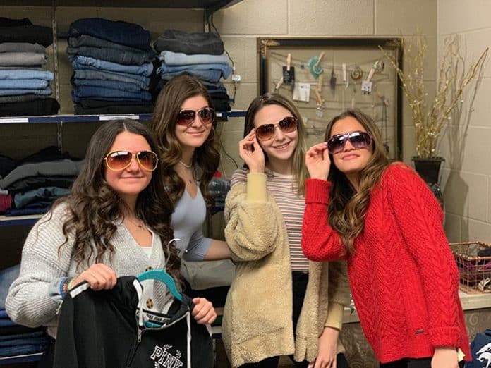 Students don sunglasses during a shopping spree at the McAuliffe Middle School Vintage Shop. (Photo courtesy Jackson Township School District)