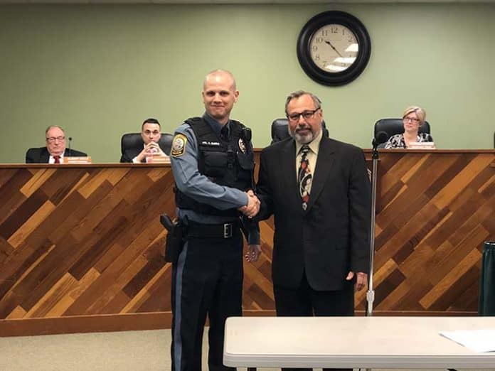 Patrolman Kristopher Burke with Deputy Mayor John Novak. (Photo by Kimberly Bosco)