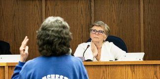 Council President Joan Brush listens to Manchester First Aid volunteer Caroline Bruckel talk about concerns with creating a township-funded first aid squad. (Photo by Jennifer Peacock)