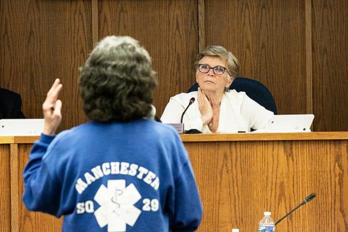 Council President Joan Brush listens to Manchester First Aid volunteer Caroline Bruckel talk about concerns with creating a township-funded first aid squad. (Photo by Jennifer Peacock)