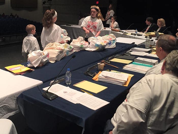 A few children of teachers brought the letters up during the Board of Education meeting. (Photo by Chris Lundy)