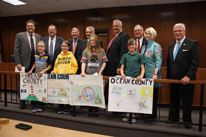 Poster contest winners pose with county officials. (Photo courtesy Ocean County)