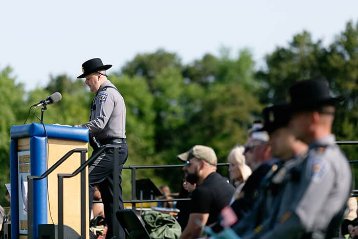 Manchester Township Police Captain Todd Malland speaks at the high school’s Memorial Day Remembrance Ceremony May 22. (Photo by Jennifer Peacock)