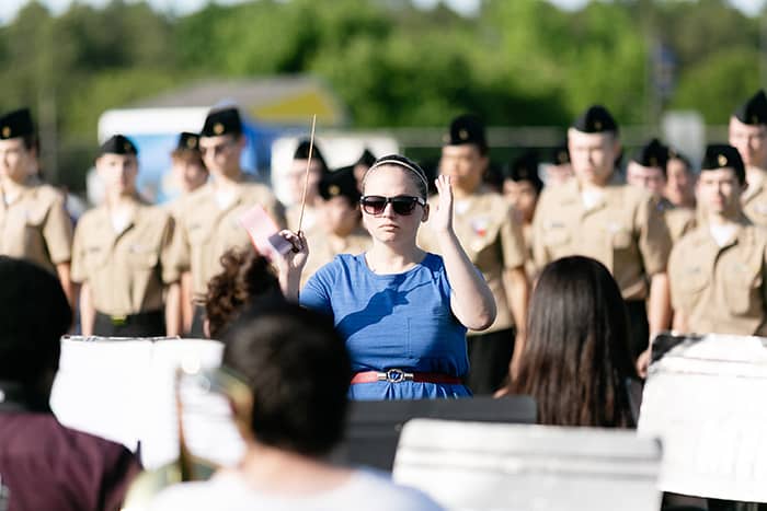 Band director Sarah Culp leads the Manchester Township High School band through a military medley. (Photo by Jennifer Peacock)