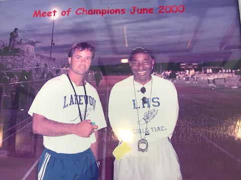 Jack Boylan (left), then the head coach of the Lakewood High School girls spring track and field team, shares a moment with assistant coach David Sauls. (Photo courtesy Jack Boylan)