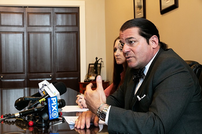 Attorney Robert Fuggi fields questions from reporters after he and his client, Ashley Stanfield, read from prepared statements. (Photo by Jennifer Peacock)