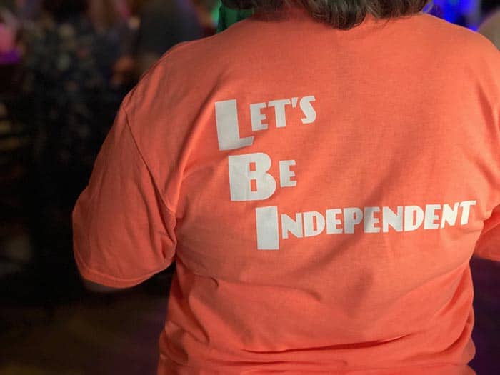 The film festival is made possible by the hard work of many volunteers. LIFF Volunteers donned their shirts made for the independent film fest at the closing celebration, which read “Let’s Be Independent.” (Photo by Kimberly Bosco)