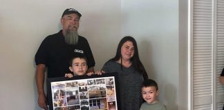 Chris Sullivan and the OCVTS team were rewarded for their efforts with thanks in the form of a framed collage from the Smith family, comprised of photos taken throughout the construction process. (Photo by Kimberly Bosco)