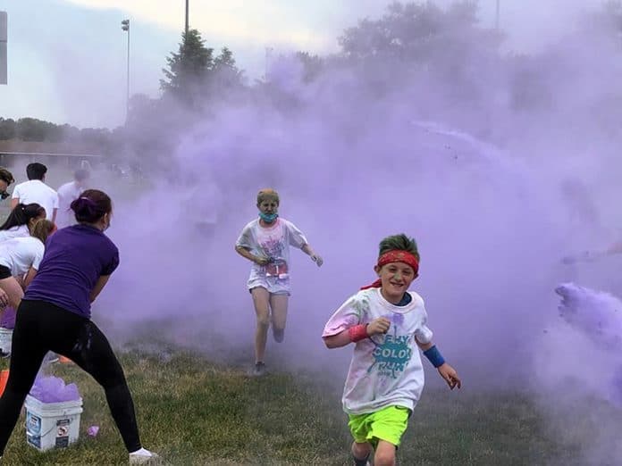 Colored corn starch paints the runners purple. (Photo by Judy Smestad-Nunn)