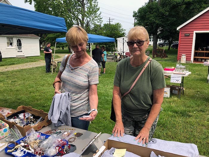 Sisters-in-law Anne Emerson (left) and Patty Wilder shop the sale. (Photo by Judy Smestad-Nunn)