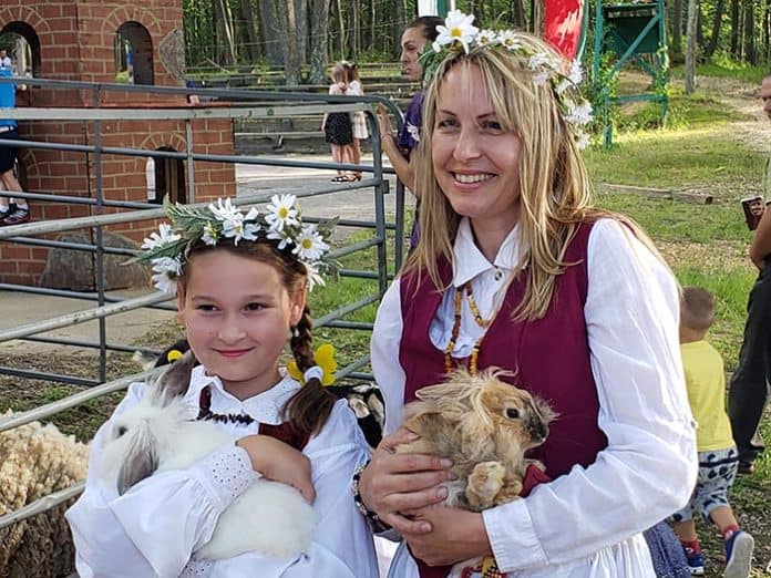 Attendees of the 10th Annual Lithuanian Festival enjoy a petting zoo provided by the Honkey Tonk Ranch. (Photo by Bob Vosseller)