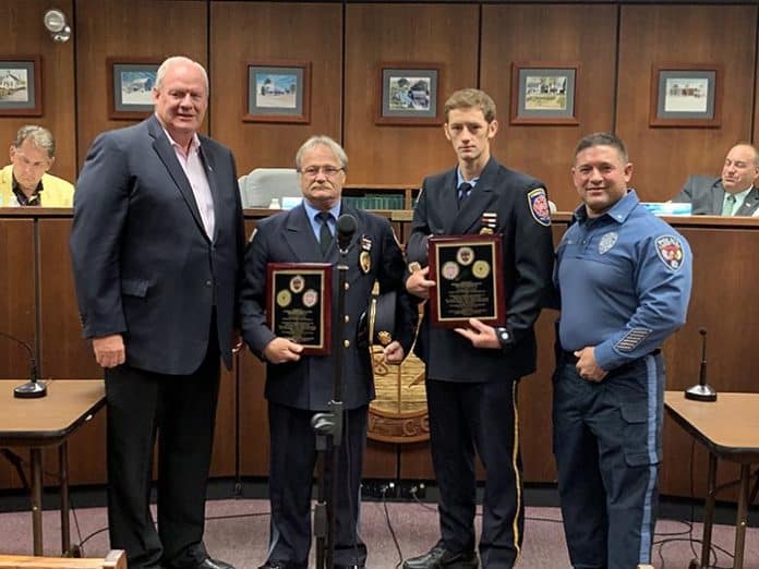 From left to right, Lacey Township Mayor Timothy McDonald, Lanoka Harbor Fire Company President Edward Barker, Forked River Firefighter Edward Barker, Jr., and Police Chief Michael C. DiBella, during the July 11, 2019 Lacey Township meeting. The police department recognized the efforts of both men related to a December 2018 water rescue. (Photo courtesy Lacey Township Police)