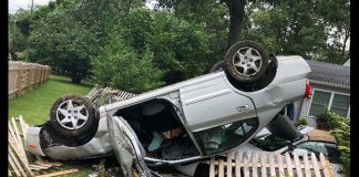 The driver landed her car atop a parked 2000 Jaguar. (Photo courtesy Toms River Police Department)