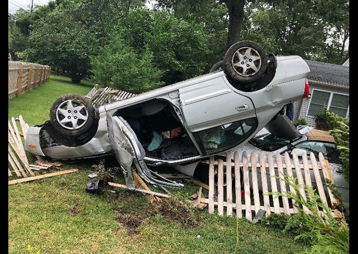 The driver landed her car atop a parked 2000 Jaguar. (Photo courtesy Toms River Police Department)