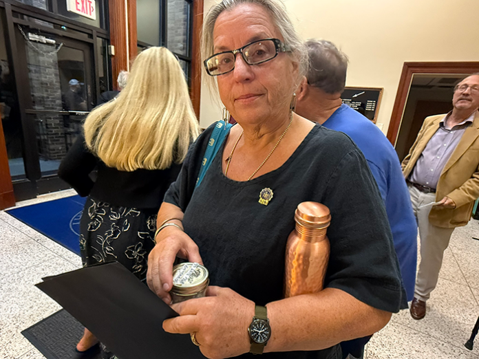 1-Carol-holding-debris